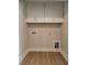 Empty laundry room with overhead cabinets and all necessary hookups at 574 Reid St, Belmont, NC 28012