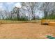 Fenced backyard with a spacious grassy area, ready for outdoor activities and relaxation at 576 Reid St, Belmont, NC 28012