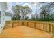 Large wooden deck overlooking a fenced backyard, ideal for entertaining and relaxation at 576 Reid St, Belmont, NC 28012