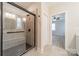 Updated bathroom featuring a glass-enclosed shower with bench seating at 576 Reid St, Belmont, NC 28012