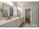 Modern bathroom with double vanity, sleek fixtures, and tiled flooring at 576 Reid St, Belmont, NC 28012