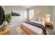 Comfortable bedroom with artwork, bedside tables, lamps, and natural light at 576 Reid St, Belmont, NC 28012
