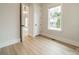 Bright bedroom with a glimpse into adjacent rooms, offering a sense of openness and flow at 576 Reid St, Belmont, NC 28012