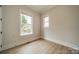 Cozy bedroom showcasing two windows, providing natural light and pleasant outdoor views at 576 Reid St, Belmont, NC 28012