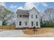 Beautiful two-story home with white siding, a well-kept yard, and a welcoming front entrance at 576 Reid St, Belmont, NC 28012