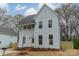 Charming two-story home with white siding, large windows, and a well-maintained front yard at 576 Reid St, Belmont, NC 28012