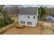 Aerial view of the backyard featuring a newly constructed deck and privacy fence at 576 Reid St, Belmont, NC 28012