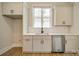 Bright kitchen featuring white cabinetry, stainless steel appliances, and natural light from the window at 576 Reid St, Belmont, NC 28012