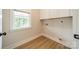 Clean laundry room space with built-in shelving and natural light at 576 Reid St, Belmont, NC 28012