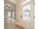 Bright and open living room with vinyl floors, large windows, and views of the outdoors at 576 Reid St, Belmont, NC 28012