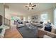 Bright living room with ample seating, stylish decor, and access to dining area at 576 Reid St, Belmont, NC 28012
