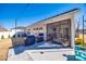 Inviting backyard patio with string lights, grill, and view of the screened-in porch, perfect for outdoor entertaining at 7133 Yardley St, Gastonia, NC 28056