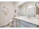 Bathroom featuring a double sink vanity with gray cabinetry and ample lighting at 7133 Yardley St, Gastonia, NC 28056