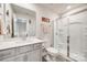 Bathroom with neutral tones, white vanity, and walk-in shower at 7133 Yardley St, Gastonia, NC 28056