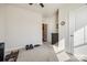 Bright, carpeted bedroom with minimalist decor and closet access at 7133 Yardley St, Gastonia, NC 28056