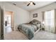 Carpeted bedroom with a ceiling fan and natural light at 7133 Yardley St, Gastonia, NC 28056