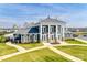 Attractive community clubhouse with stone accents, white columns, and professionally landscaped grounds at 7133 Yardley St, Gastonia, NC 28056