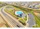 Aerial view of a community pool, clubhouse, parking and other recreational amenities in a residential area at 7133 Yardley St, Gastonia, NC 28056