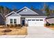 Charming single-story home features a two-car garage and well-maintained landscaping at 7133 Yardley St, Gastonia, NC 28056