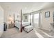 Beautiful bedroom with a four poster bed, soft colors, and lots of natural light at 7133 Yardley St, Gastonia, NC 28056