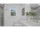 Stylishly appointed bathroom with tub/shower, toilet, vanity, and window at 7215 Kilcullen Dr, Charlotte, NC 28270