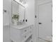 Bright bathroom features a marble vanity with shaker cabinets, stylish mirror, and white door at 7215 Kilcullen Dr, Charlotte, NC 28270