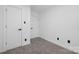 Clean, modern bedroom features two closets, fresh white paint, and neutral carpet at 7215 Kilcullen Dr, Charlotte, NC 28270