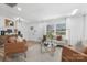 Cozy living room featuring hardwood floors, comfortable seating, and abundant natural light at 7215 Kilcullen Dr, Charlotte, NC 28270