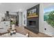 Inviting living room with a modern fireplace, an open layout and wood flooring at 7215 Kilcullen Dr, Charlotte, NC 28270