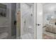 Elegant marble shower with a rainfall showerhead and glass door with gold finishings at 7215 Kilcullen Dr, Charlotte, NC 28270