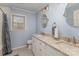 Bathroom boasts granite counters, double sinks, and a framed mirror at 748 Saint Cloud Dr, Statesville, NC 28625