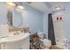 Functional bathroom featuring a tiled shower and single sink vanity at 748 Saint Cloud Dr, Statesville, NC 28625