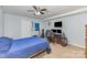This bedroom has a ceiling fan, space for a desk, and wall art at 748 Saint Cloud Dr, Statesville, NC 28625