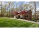 Charming two-story brick home with a well-manicured lawn and mature trees, perfect for a Gathering at 748 Saint Cloud Dr, Statesville, NC 28625