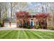 Beautiful brick home featuring a two-car garage and lush landscaping, offering curb appeal and convenience at 748 Saint Cloud Dr, Statesville, NC 28625