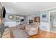 Inviting living room featuring hardwood floors, built-in shelving, and ample space for relaxation at 748 Saint Cloud Dr, Statesville, NC 28625