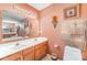 Bathroom featuring a double vanity and decorative wall sconces at 8134 Chatham Oaks Dr, Concord, NC 28027