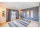 Spacious bedroom with neutral walls, a large window, and decorative mirrors creating an open feel at 8134 Chatham Oaks Dr, Concord, NC 28027