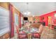 Dining area with a glass table and red-patterned chairs at 8134 Chatham Oaks Dr, Concord, NC 28027