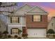 Two-story home featuring siding, brick and well-manicured landscaping at 8134 Chatham Oaks Dr, Concord, NC 28027