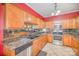 Kitchen with stainless steel appliances and ample wooden cabinetry at 8134 Chatham Oaks Dr, Concord, NC 28027