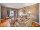 Comfortable living room features hardwood floors, textured walls, and stylish decor at 8134 Chatham Oaks Dr, Concord, NC 28027