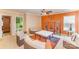 Cozy living room features a ceiling fan, decorative shelving unit, and comfortable seating arrangement at 8134 Chatham Oaks Dr, Concord, NC 28027