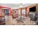 Open concept living room with fireplace and adjacent kitchen area at 8134 Chatham Oaks Dr, Concord, NC 28027