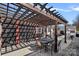 Outdoor living space with covered pergola, dining and lounge seating, and a pool, perfect for summer days at 8408 Williamsburg Cir, Huntersville, NC 28078