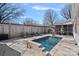 Inviting backyard pool area featuring comfortable seating, perfect for outdoor relaxation and entertaining at 8408 Williamsburg Cir, Huntersville, NC 28078