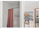 Shower and storage space with fresh towels create a spa like feel in the bathroom at 8408 Williamsburg Cir, Huntersville, NC 28078