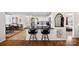 Open kitchen features black countertops, breakfast bar seating, and stainless steel appliances at 8408 Williamsburg Cir, Huntersville, NC 28078