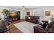 Cozy living room with plush leather seating, large windows, and stylish decor at 8408 Williamsburg Cir, Huntersville, NC 28078