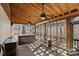 Spacious screened in patio with hot tub and lounge seating at 8408 Williamsburg Cir, Huntersville, NC 28078